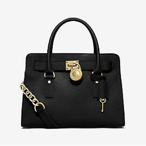 New Michael Kors purse with gold lock and key